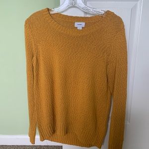 Mustard-colored sweater